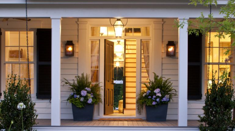 Close up of front porch with open front door