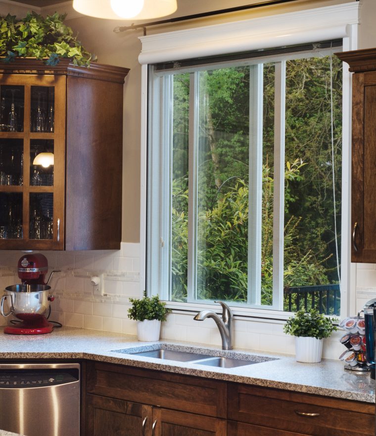 Family home kitchen with retractable window screens