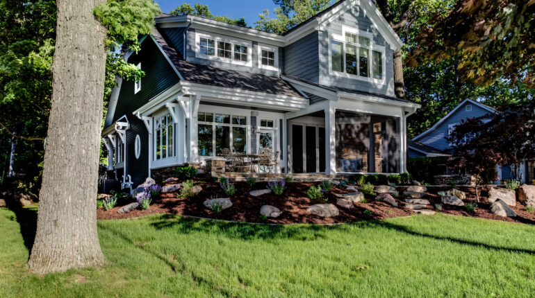 American home with rolled down motorized screen porch