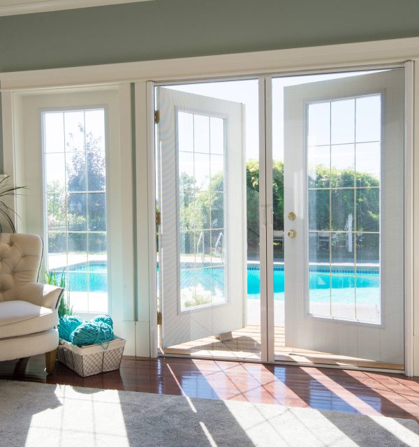 Looking out on to a pool through Phantom retractable screens