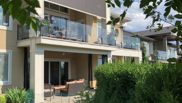 Home with roll up outdoor screen on patio