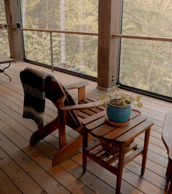 Close up of patio chairs on wooden decking