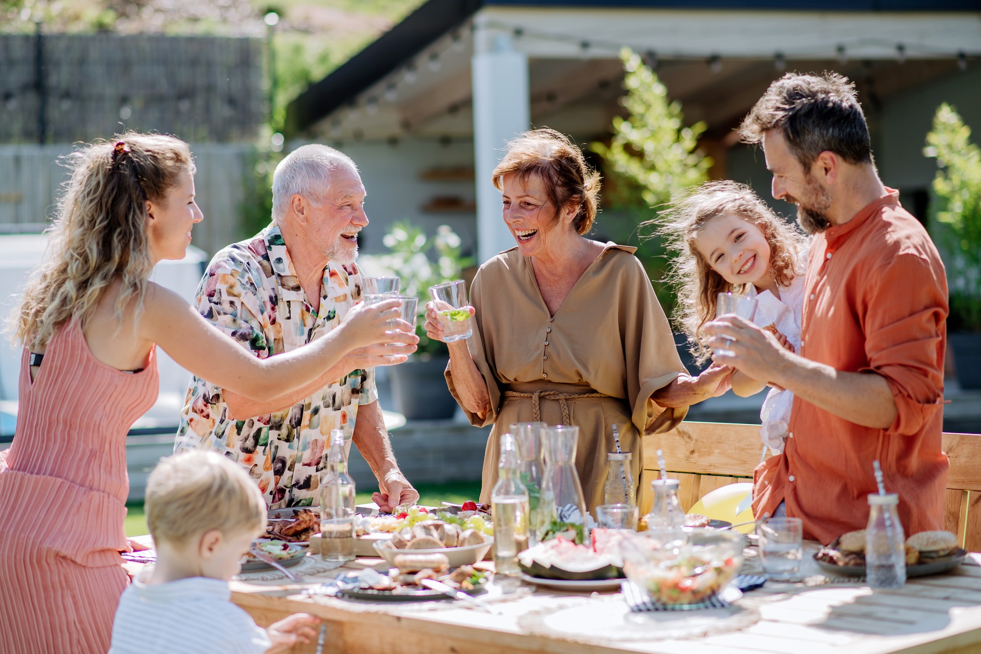 Group of family toasting outside