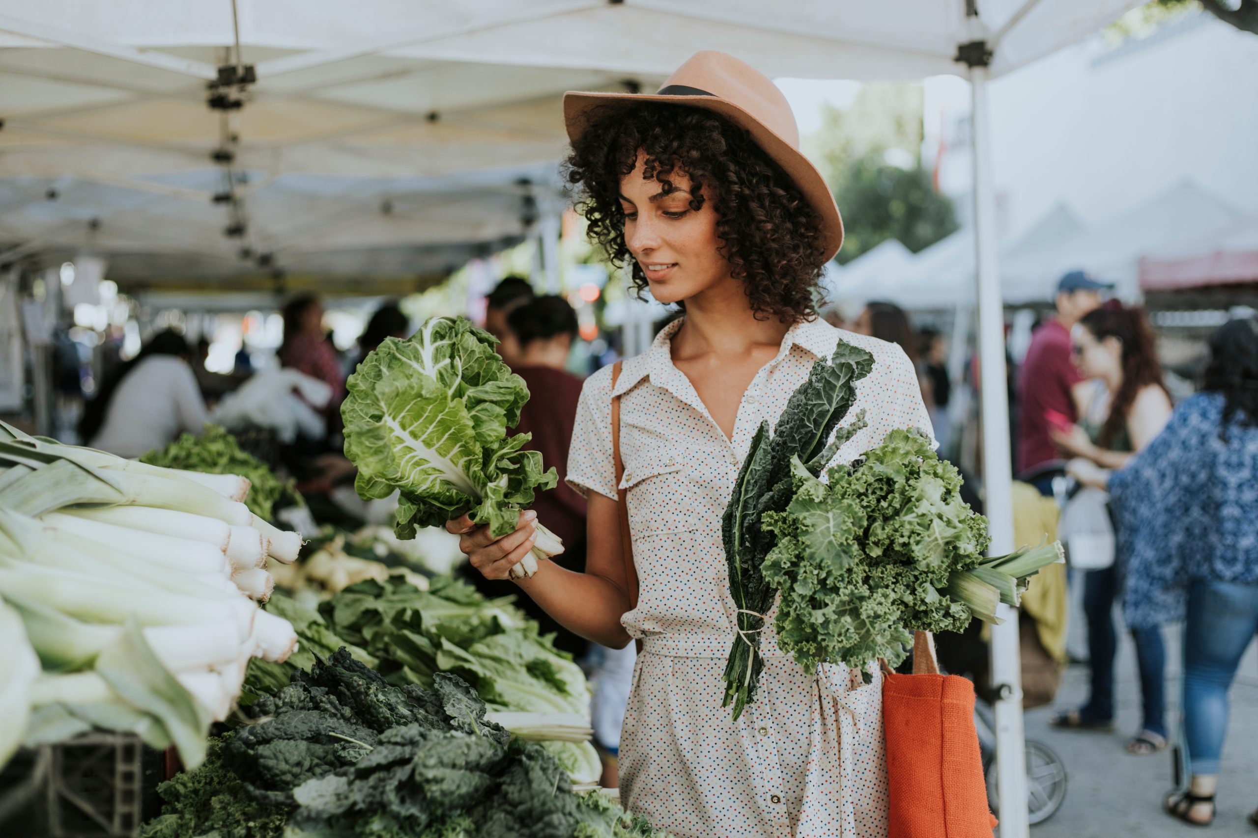 Woman looking at produce at a farmer's market