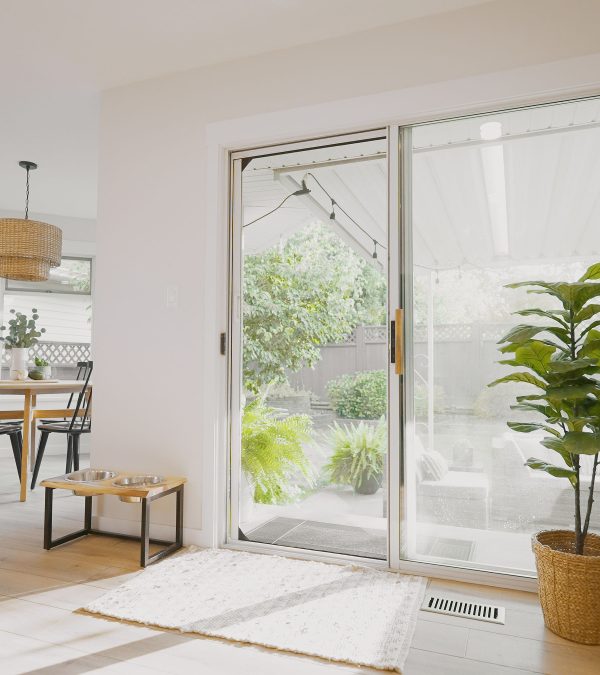 Living room sliding door with Phantom Screens looking out to backyard