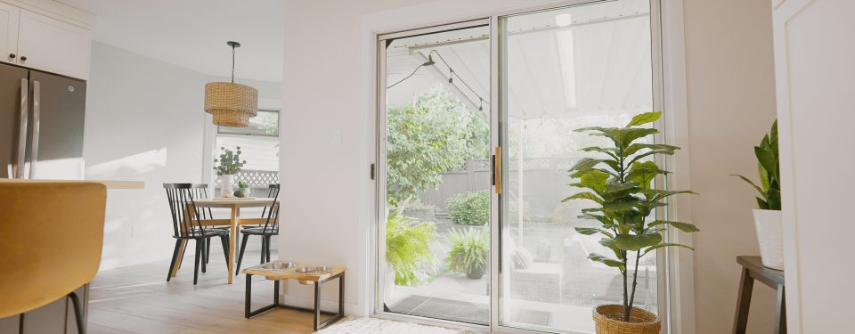 Living room sliding door with Phantom Screens looking out to backyard