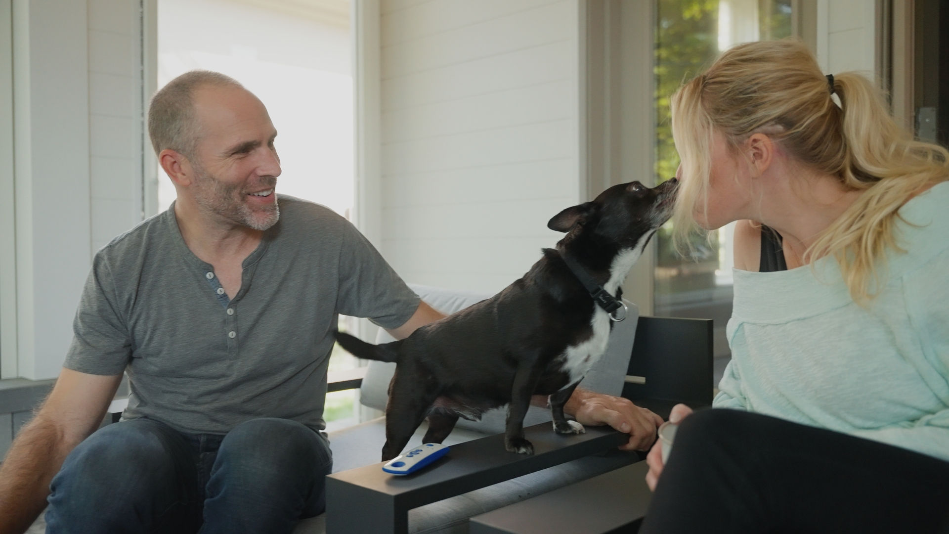 Mike Weaver and Carrie Rowan enjoying quality pet time with their small dog