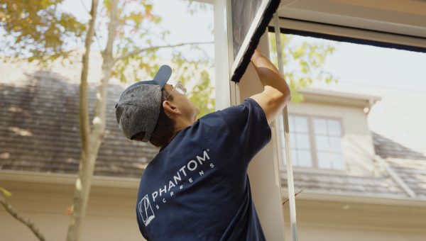 Phantom Screens installer working on a phantom motorized screen